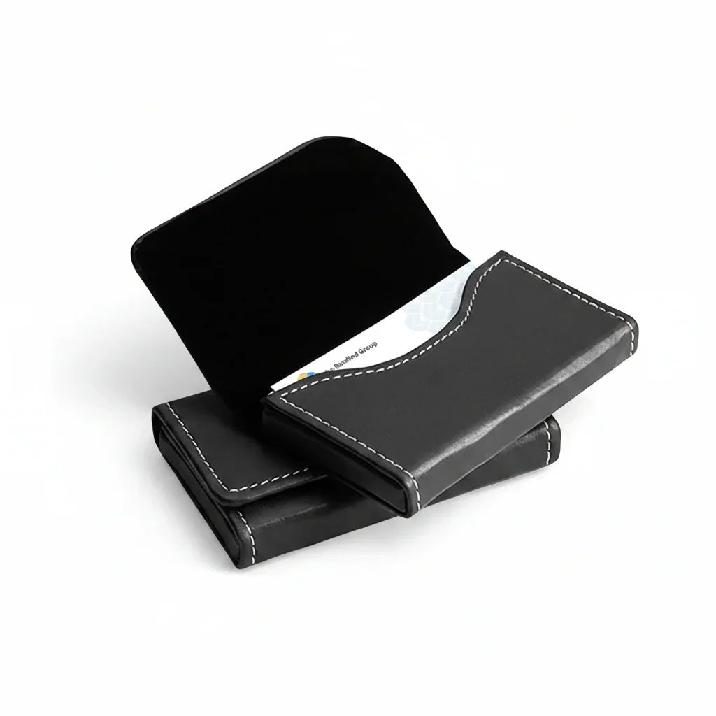 Black leather horizontal business card holders with white stitching, one open showing cards inside