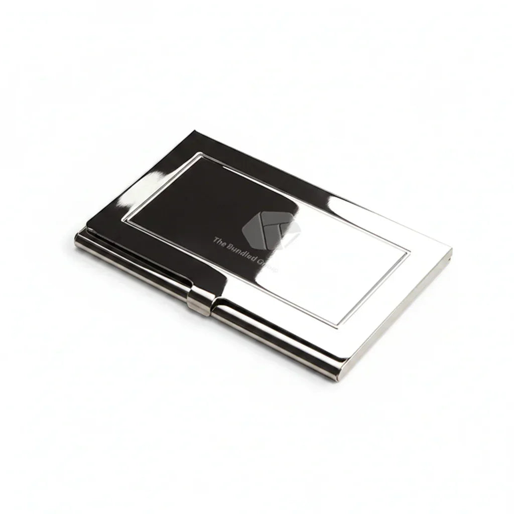 Sleek engraved metal business card holder with reflective silver finish on white background