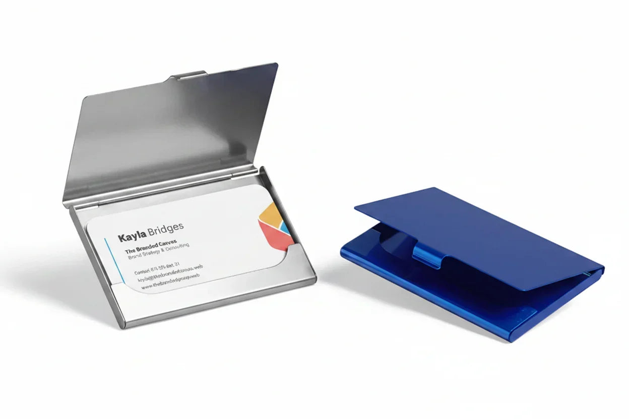 Aluminum business card holders, one open with cards and one closed, on white background.
