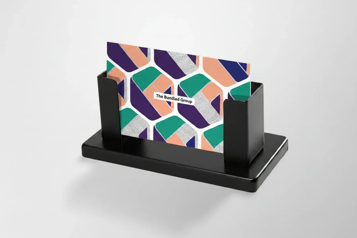 Steel desk business card holder with geometric card in black holder on white background