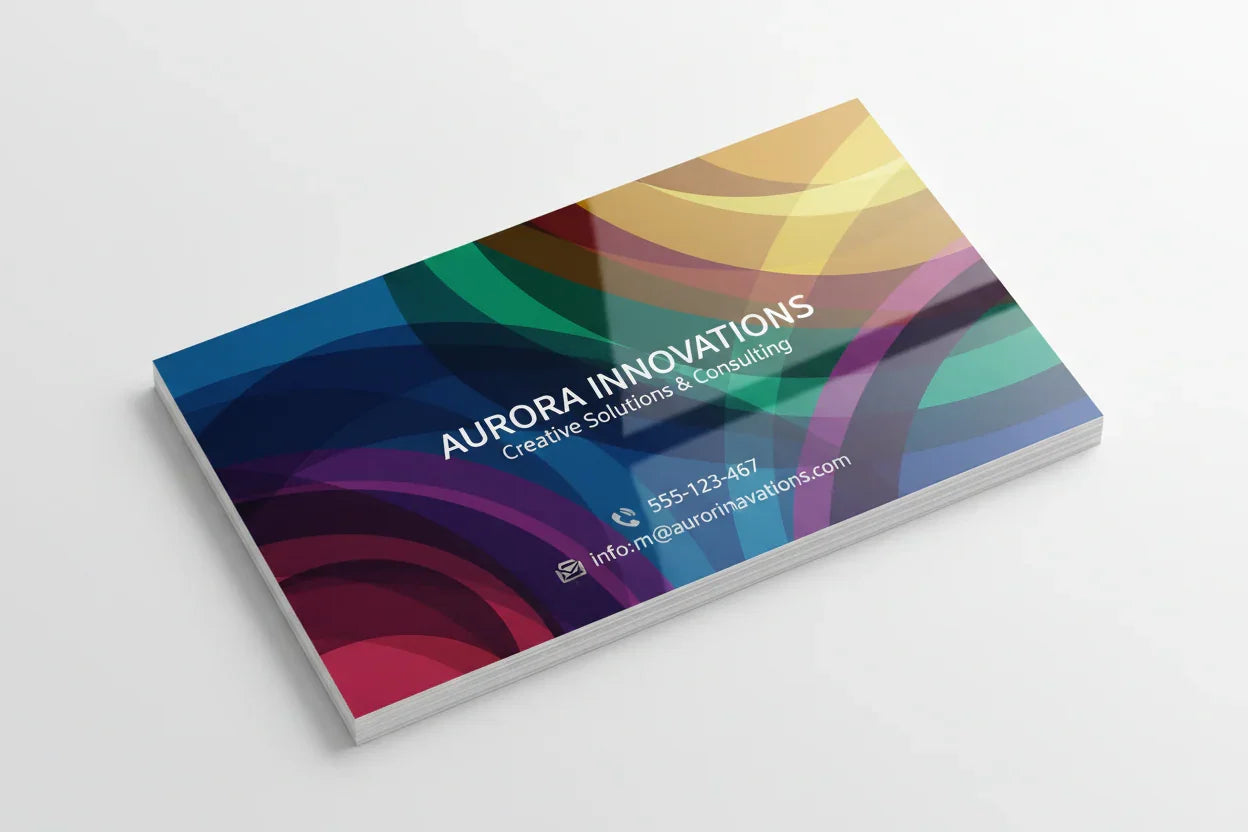 Colorful business card with glossy finish and abstract design on white background