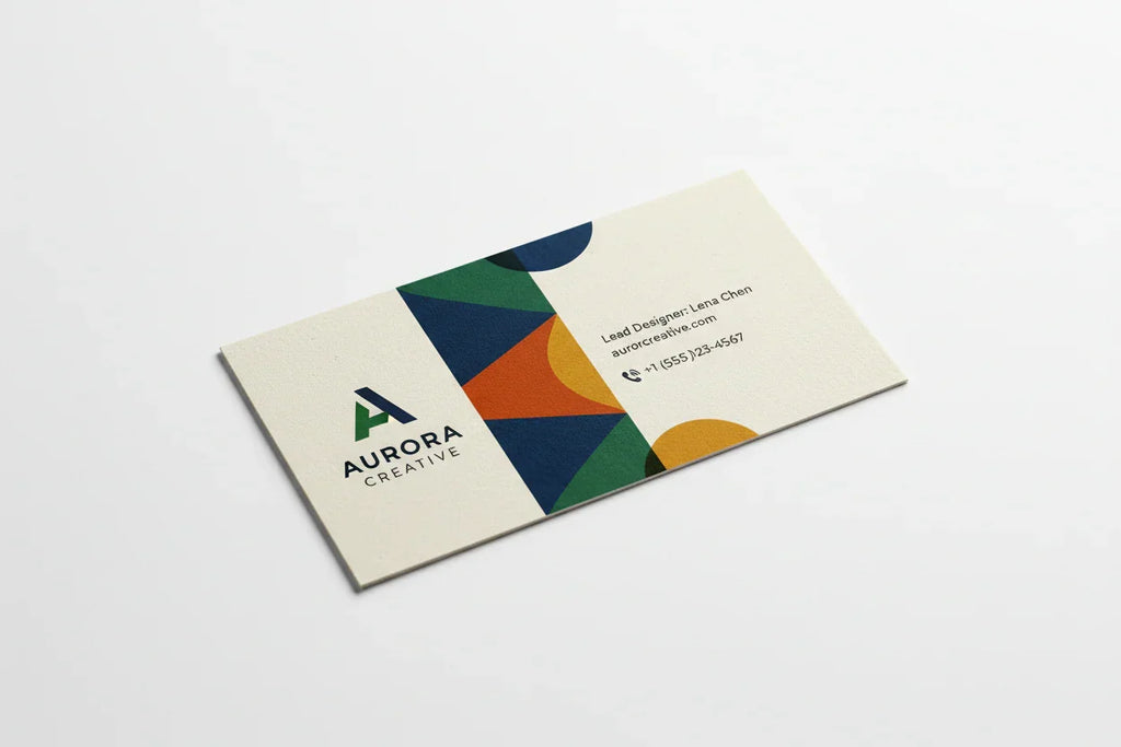 Color printed business card on uncoated stock with geometric design on white background