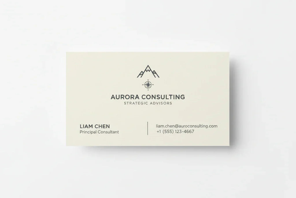 Single-color business card on matte cardstock with minimalist text and mountain logo on white background
