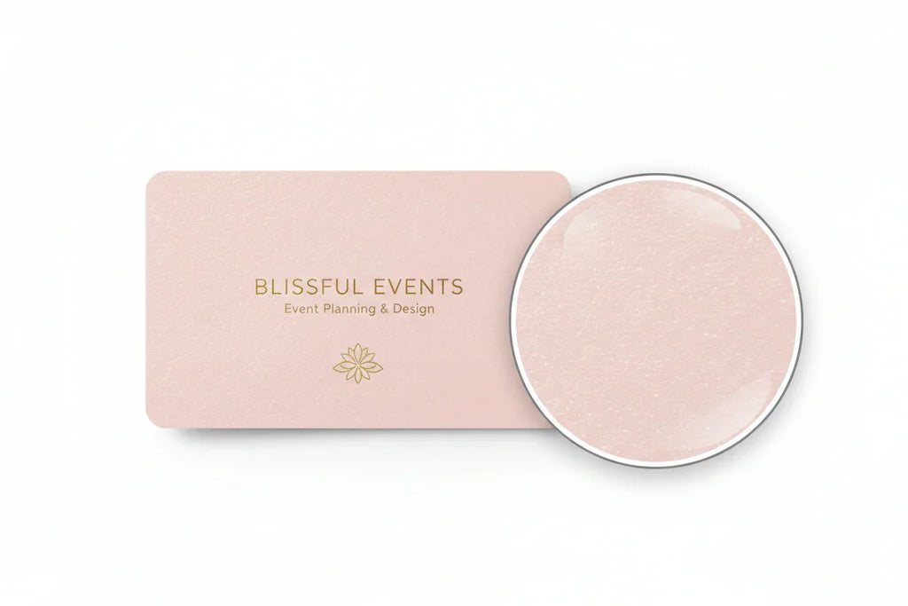 Single pink rectangular business card on pearl stock, with circle detail magnifying paper texture