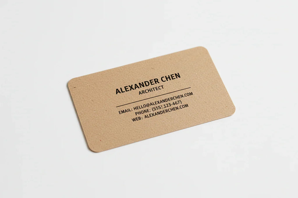 Rectangular kraft business card with rounded corners and black minimalist text on white background.