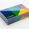 Glossy color business cards stacked on white background, custom printed design.