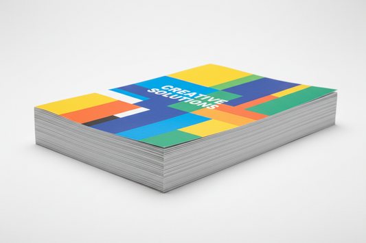 a stack of single page color flyers on a white background