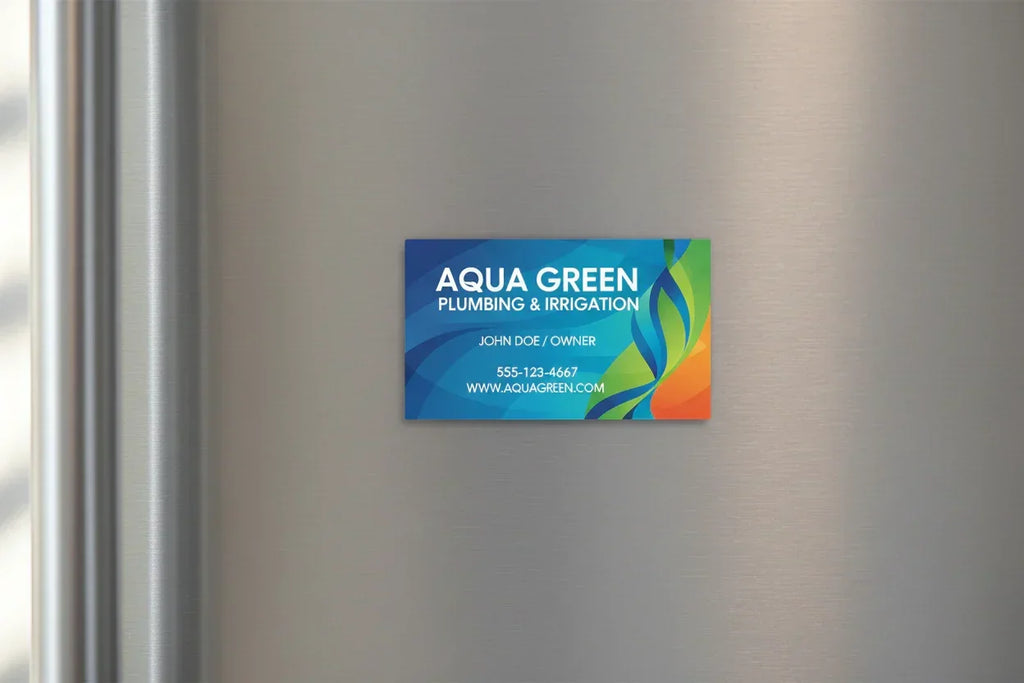 Colorful rectangular magnetic business card on silver metal fridge door