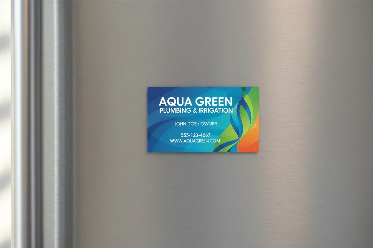 Colorful rectangular magnetic business card on silver metal fridge door