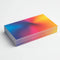 Stack of rectangular matte laminated business cards with colorful gradient design on white background